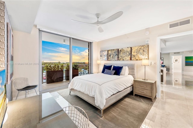 bedroom featuring access to outside, visible vents, a wall of windows, and a ceiling fan