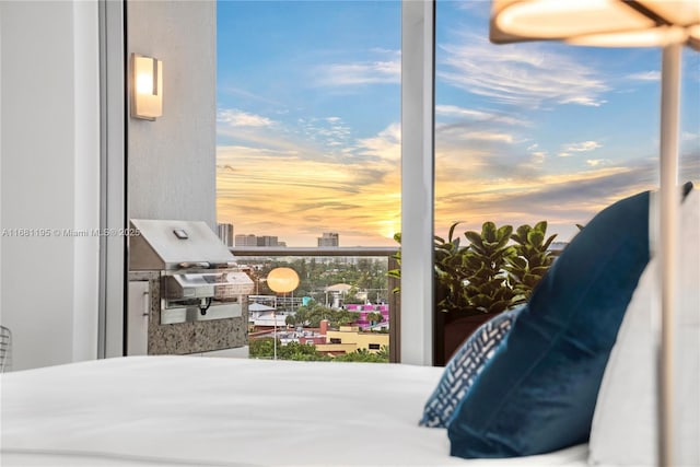 bedroom featuring a city view