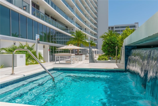 pool with a patio area