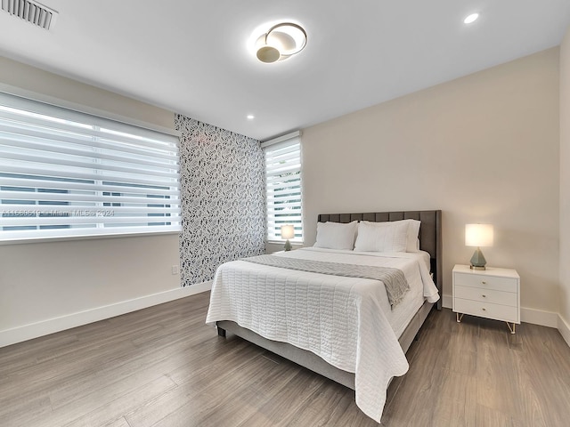 bedroom featuring wood-type flooring