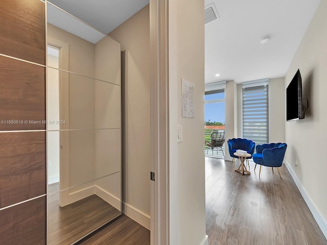 1808 Coral Ridge Dr Unit 1808, Fort Lauderdale, FL 33305 - corridor with baseboards, wood finished floors, and visible vents
