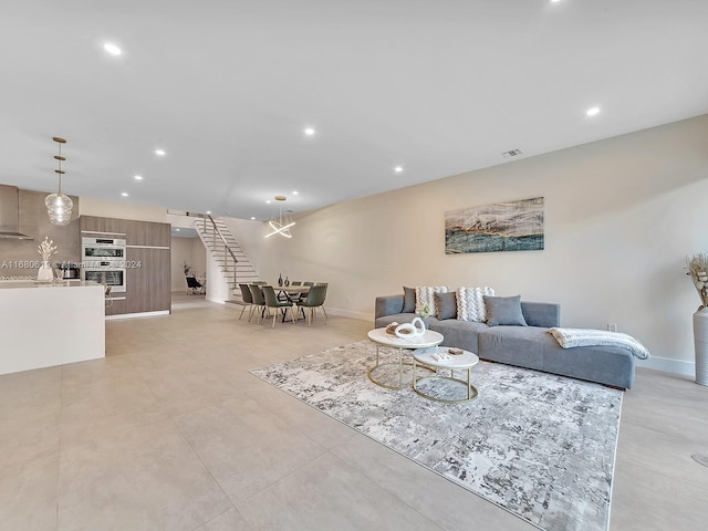 living room featuring an inviting chandelier