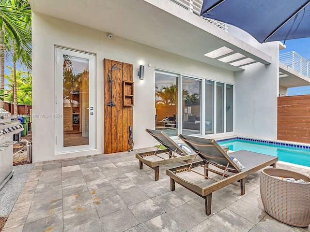 1808 Coral Ridge Dr Unit 1808, Fort Lauderdale, FL 33305 - view of patio / terrace featuring fence and a fenced in pool