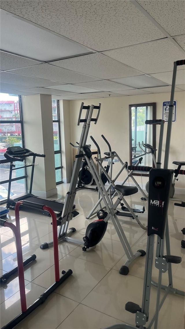 workout area featuring a paneled ceiling