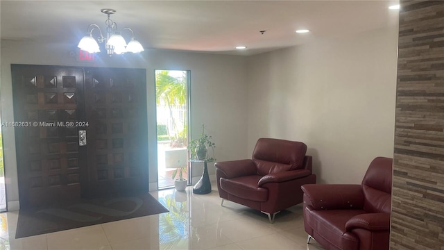 sitting room featuring an inviting chandelier