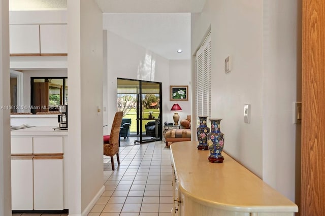 corridor featuring light tile patterned flooring