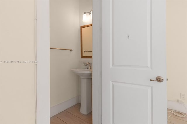 bathroom with tile patterned flooring and sink