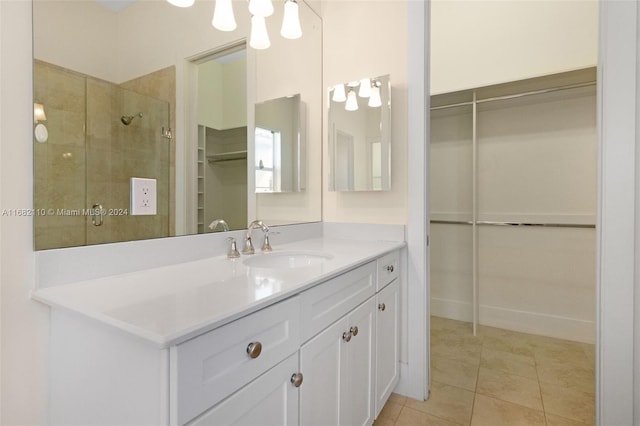 bathroom featuring tile patterned flooring and vanity