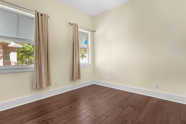 spare room featuring hardwood / wood-style floors