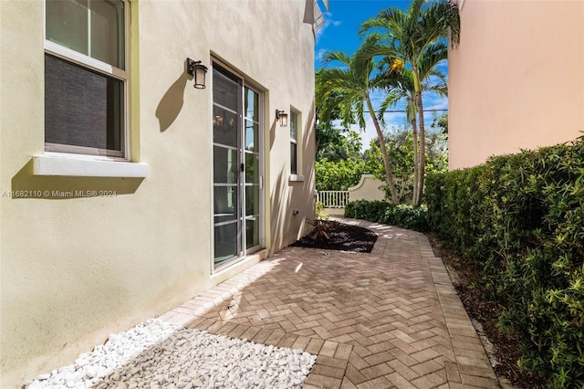 view of side of property featuring a patio