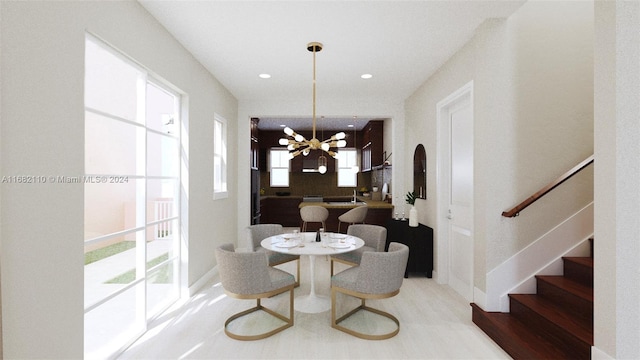 dining room featuring hardwood / wood-style floors and an inviting chandelier