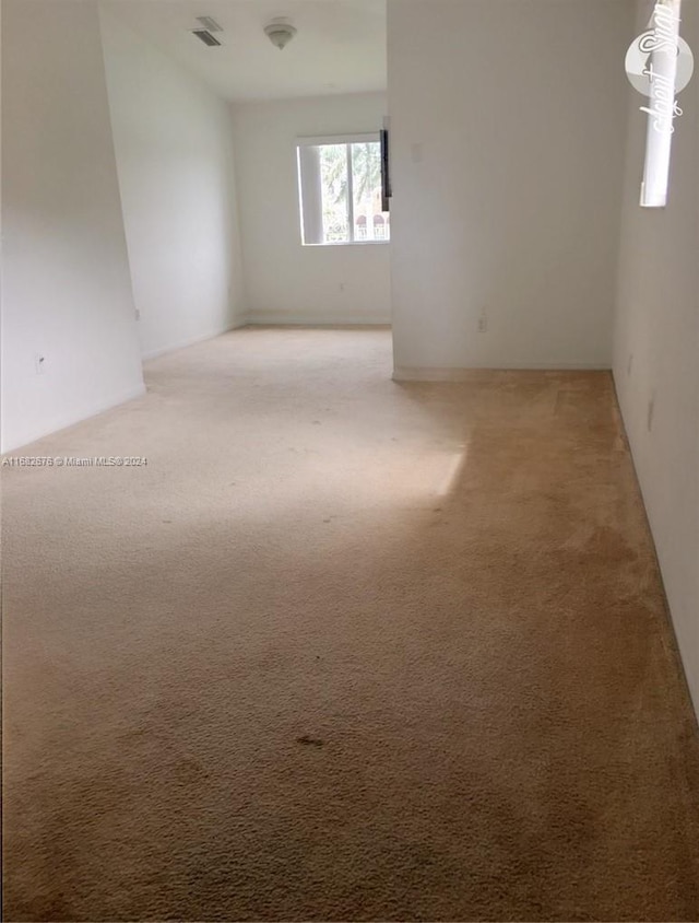 spare room with carpet floors