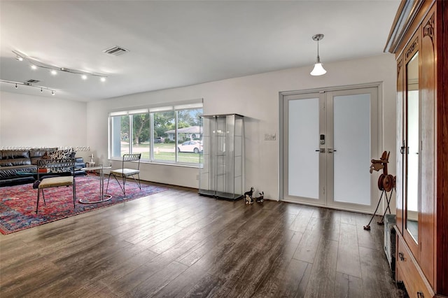 living room featuring french doors and dark hardwood / wood-style flooring