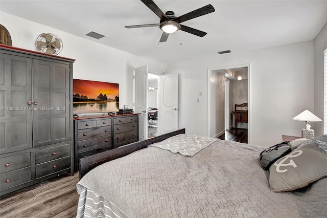 bedroom featuring hardwood / wood-style flooring and ceiling fan