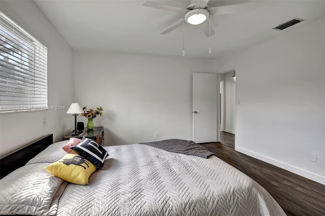 bedroom with ceiling fan and wood-type flooring