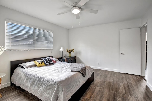 bedroom featuring dark hardwood / wood-style flooring and ceiling fan