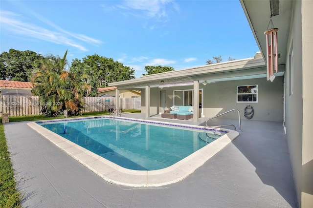 view of pool featuring a patio area and ceiling fan