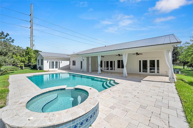 view of swimming pool with a patio area, an in ground hot tub, and ceiling fan