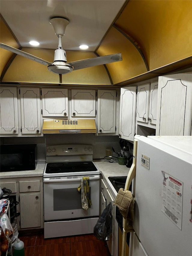 kitchen with lofted ceiling, white electric range, fridge, dark wood-type flooring, and range hood