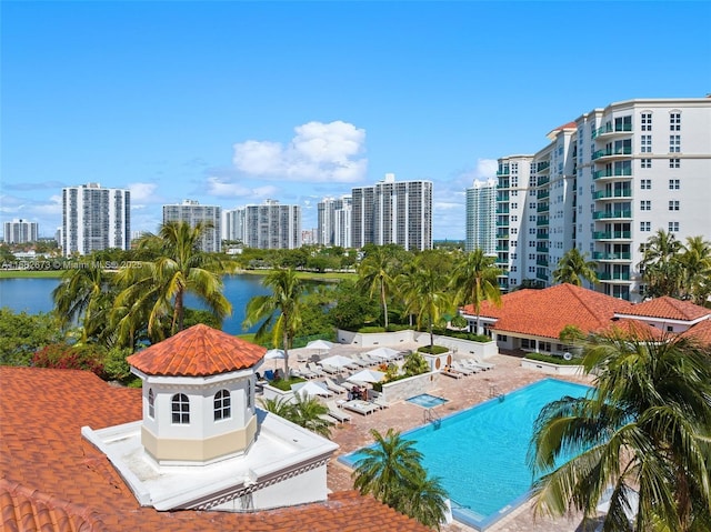 view of pool featuring a water view