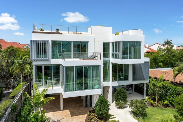 rear view of house with a balcony