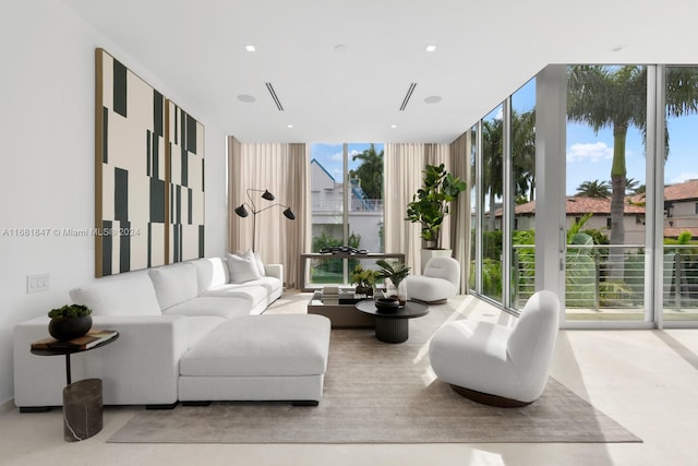 living room featuring expansive windows and a wealth of natural light