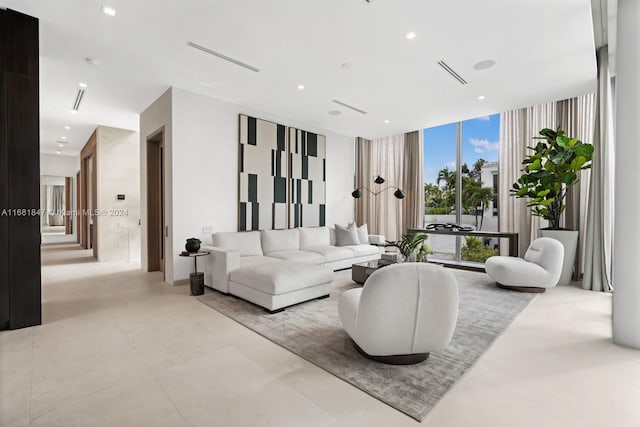 living room with floor to ceiling windows