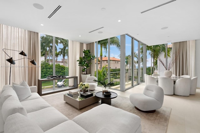 living room with expansive windows and a wealth of natural light