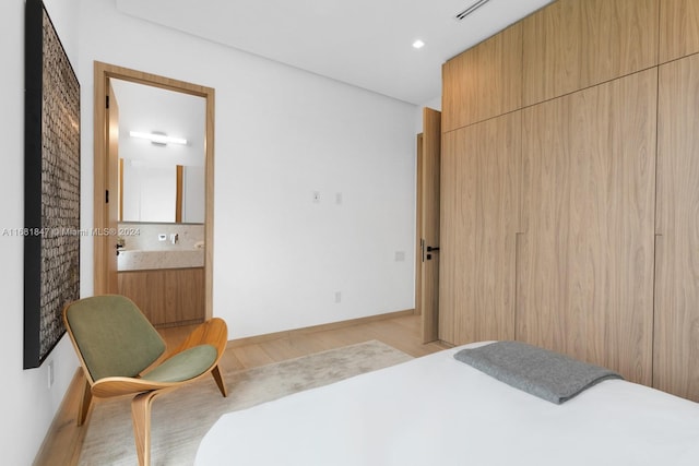 bedroom with light hardwood / wood-style floors