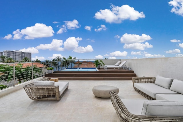 view of patio featuring an outdoor hangout area and a balcony