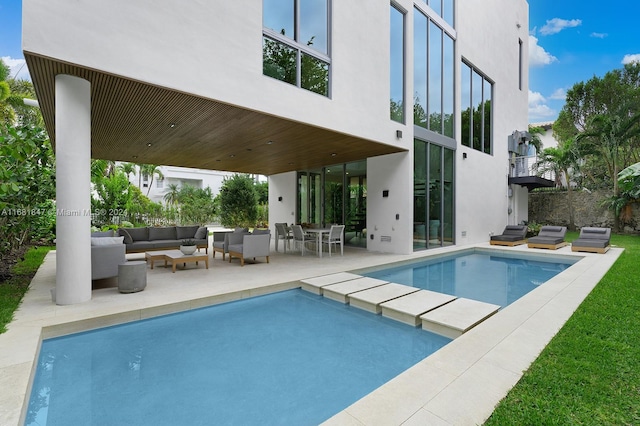 view of pool featuring a patio area and an outdoor living space