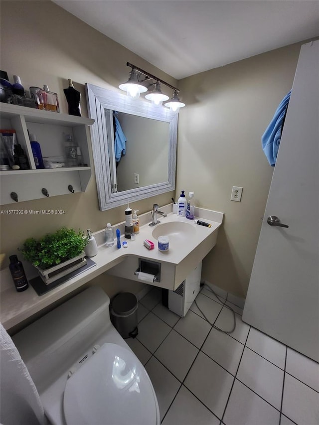 bathroom featuring vanity, toilet, and tile patterned flooring