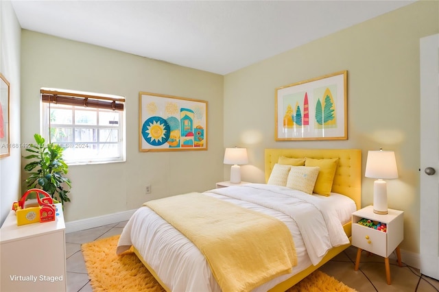 bedroom featuring light tile patterned floors