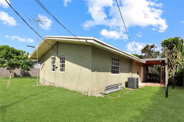 back of house with a patio, central AC, and a lawn