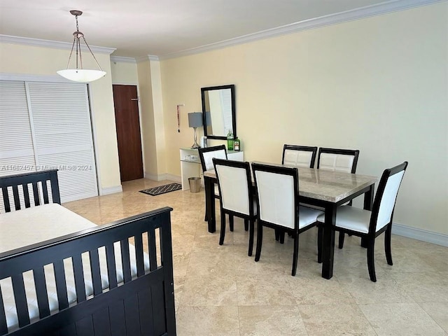 dining space with crown molding and baseboards