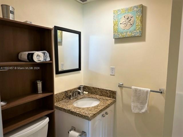 half bath with toilet and vanity