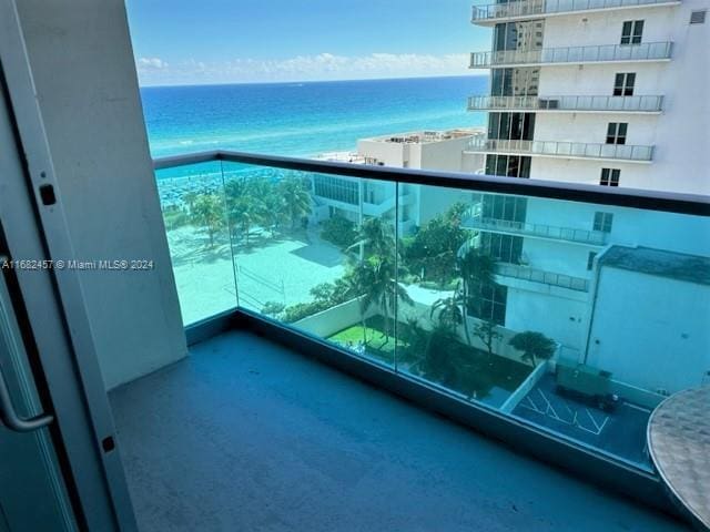 balcony featuring a water view