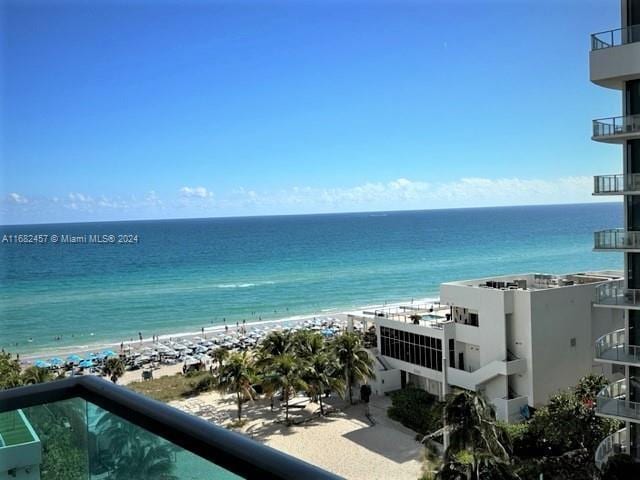 view of water feature with a beach view