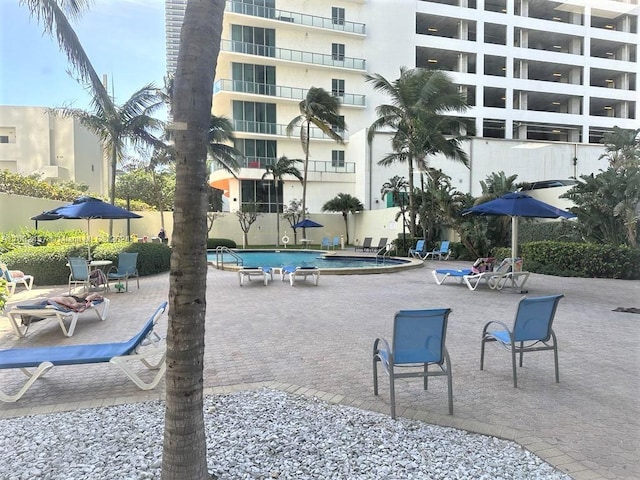 view of swimming pool with a patio