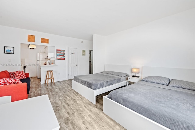 bedroom featuring light wood-type flooring