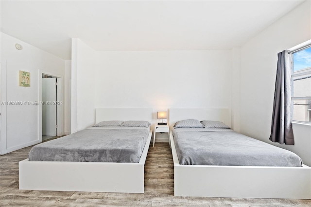 bedroom featuring wood-type flooring