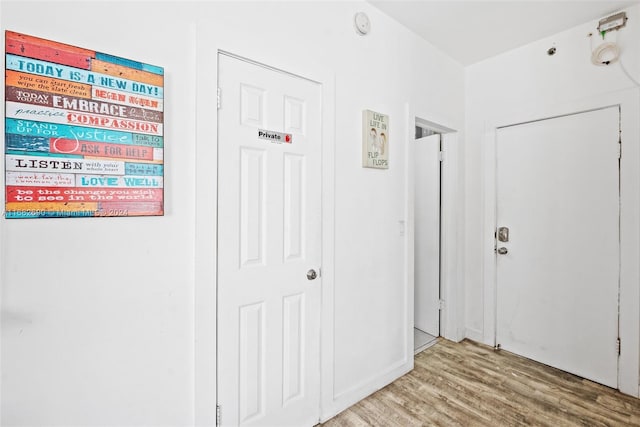 hallway featuring light hardwood / wood-style flooring