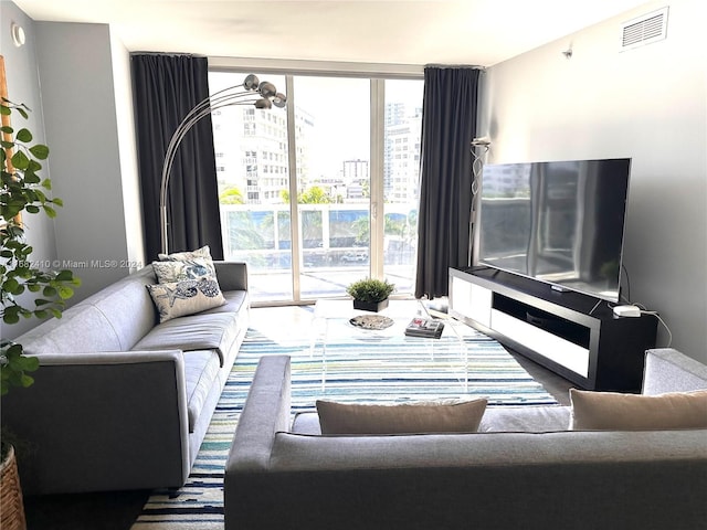1800 S Ocean Dr Unit 508, Hallandale Beach, FL 33009 - living area with visible vents and a wealth of natural light