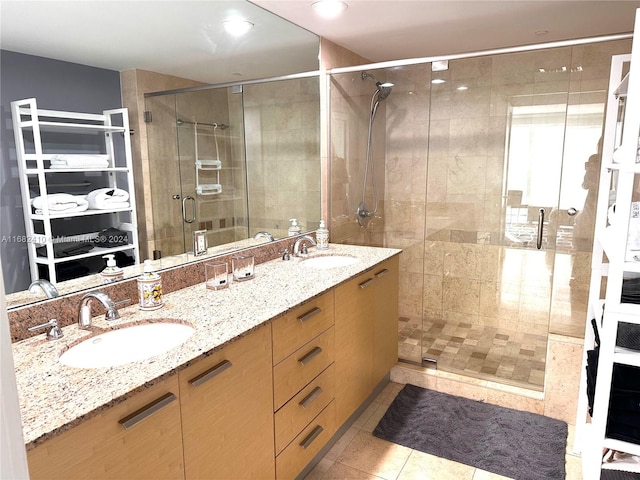 bathroom with vanity, walk in shower, and tile patterned floors