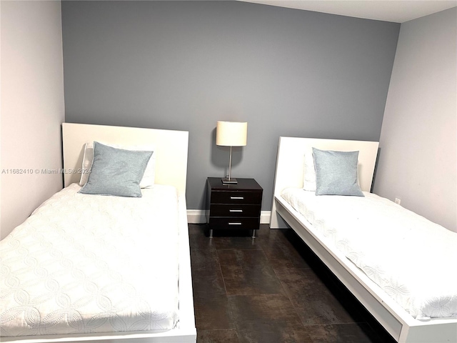 bedroom featuring dark hardwood / wood-style flooring