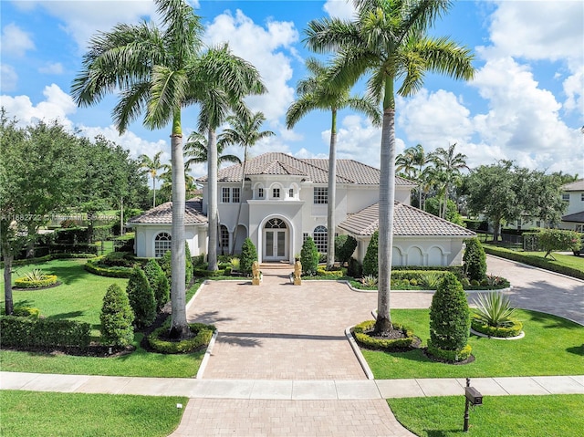 mediterranean / spanish-style home featuring a front lawn