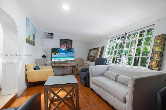 tiled living room with a wall mounted air conditioner, lofted ceiling, and ornamental molding