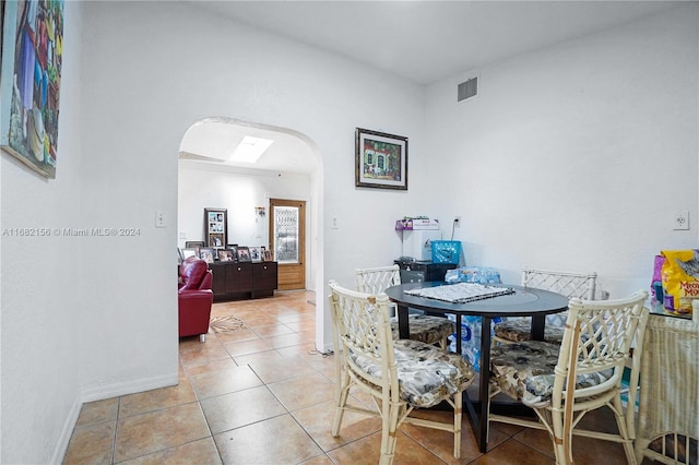 dining room featuring light tile patterned flooring