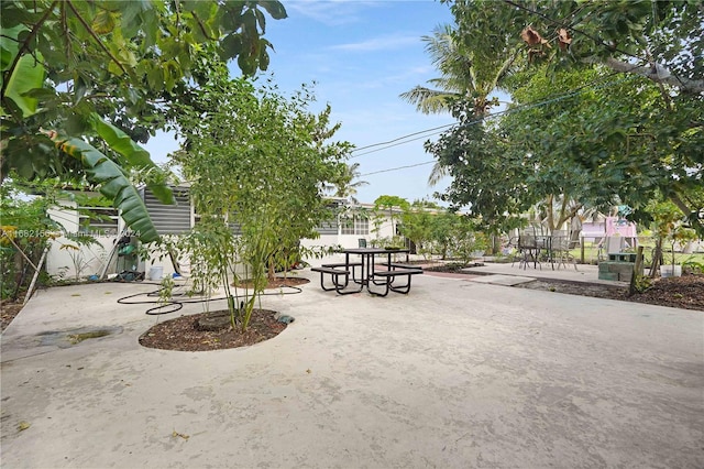 view of home's community with a patio area