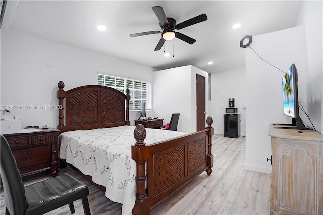 bedroom featuring light hardwood / wood-style flooring and ceiling fan